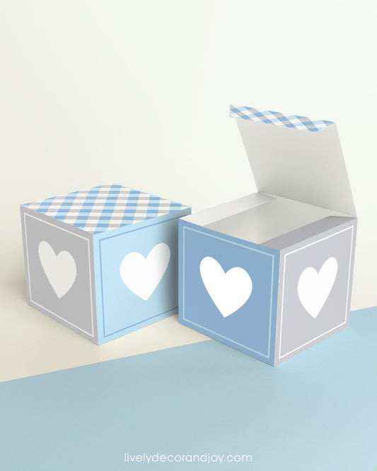 Two cubes with a heart on the sides. One has the lid open, showing it is a box. Both made with the same template.
