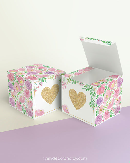 Two cubes with a heart on the front. One has the lid open, showing it is a box. Both made with the same template.