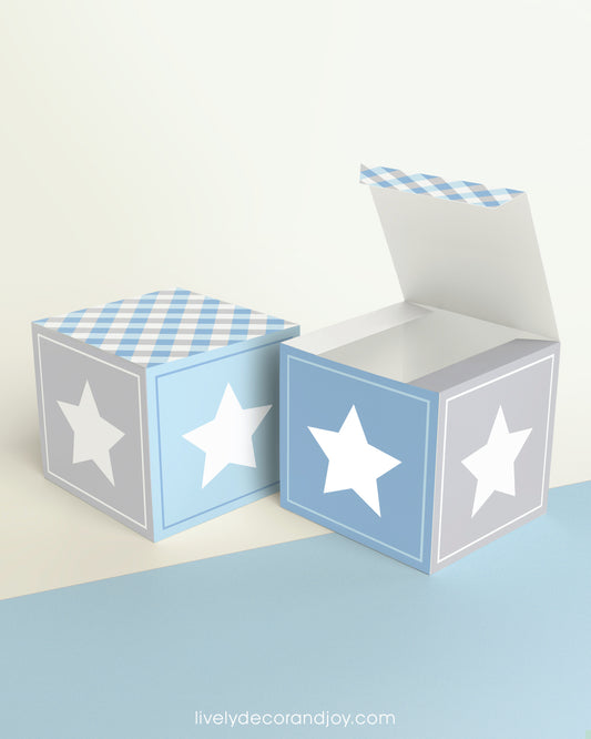 Paper building block and a star on the sides shown both as a cube and as an open box.