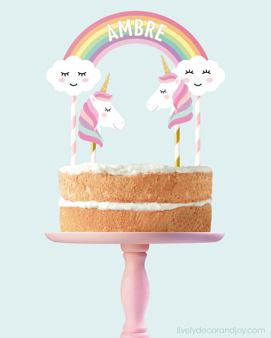 Smash cake with a printable rainbow and unicorn topper. Name personalization.