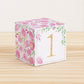 Paper cube with floral motifs in pink and green and the number 1 in gold on the front. Made from a printable design.