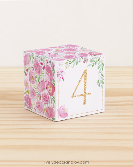 Building block with floral design and gold number 4 on the front. Part of a collection of printable alphabet building blocks.