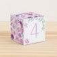 Building block with floral design and lavender number 4 on the front. Part of a collection of printable alphabet blocks.