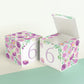 Two paper cubes with purple floral designs and the digit 6 in lavender. One has the top open, showing it can be a box.