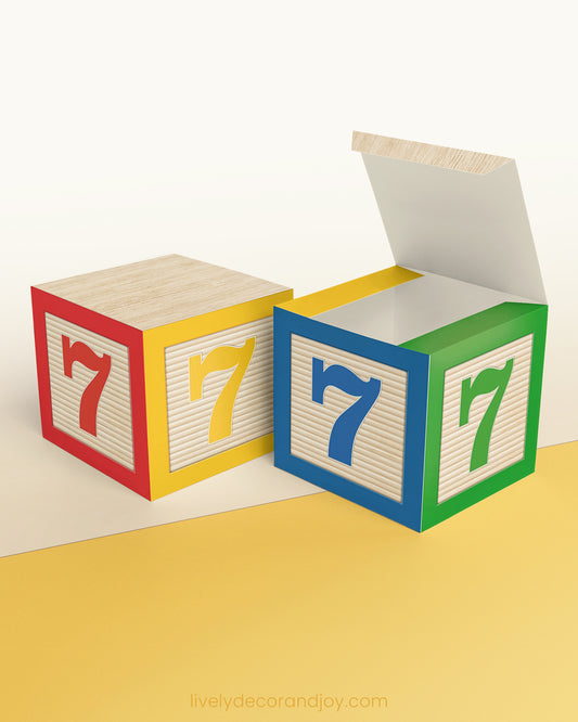 Paper cube in red, yellow, blue, and green and the number 7 on the sides. Made from a printable design.