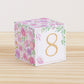 Baby block with blush flowers and the digit 8 in peach on the front.