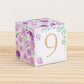 Paper building block with the number 9 in gold and floral designs in purple and green. Made from a printable template.