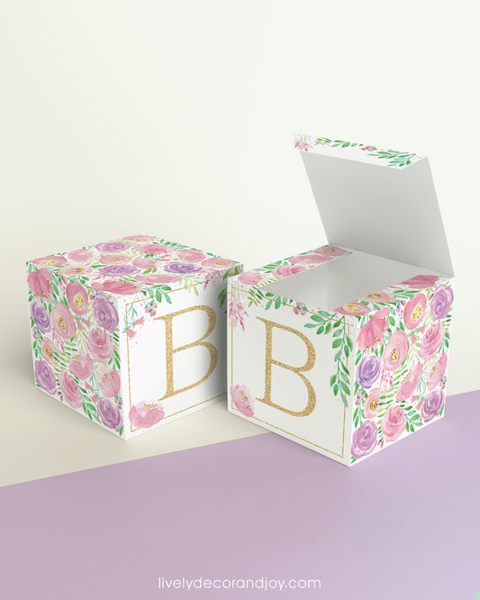 Two blocks side by side, one with the lid open to show that the printable cube template can also be used to make a box.
