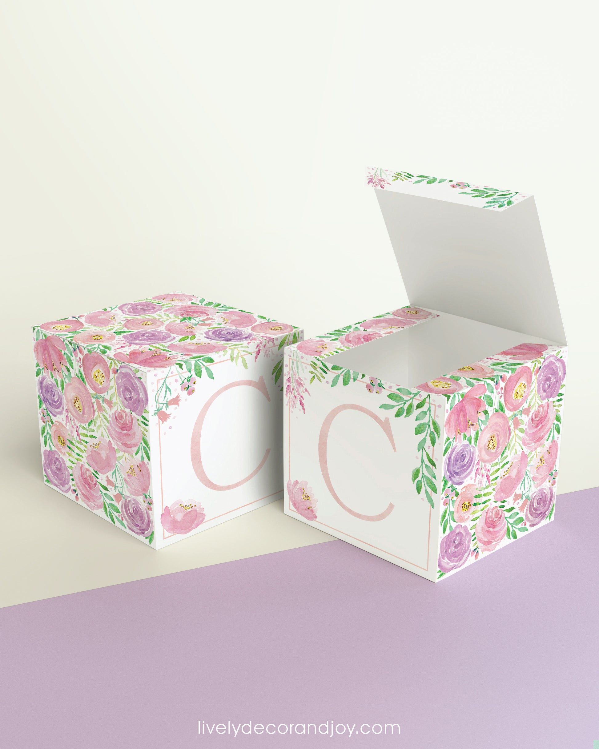 A completely closed block in the form of a cube and a box with an open lid. Both feature the same printable design.