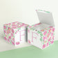Two floral paper building blocks with the same feminine designs. One has an open top to show that it can also be a box.