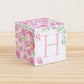 Paper cube with floral cottagecore motifs and a capital H on the front. It features pink and green flowers and leaves.