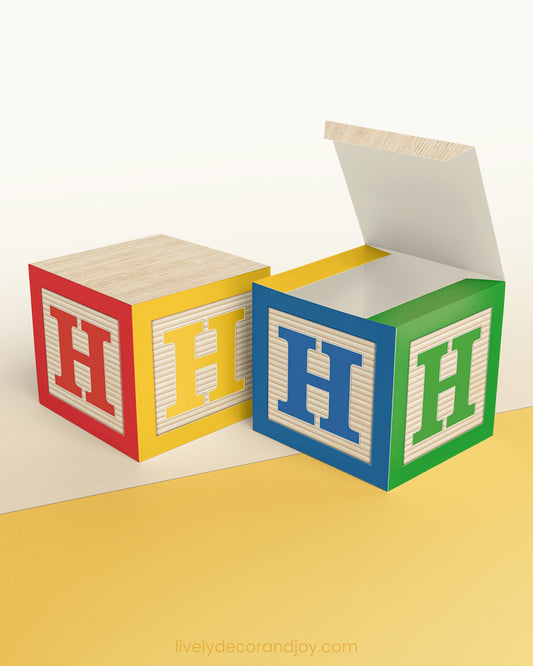 Classic ABC cube in primary colors and green. It has the capital H on the sides.