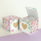 Two cubes with a heart on the front. One has the lid open, showing it is a box. Both made with the same template.