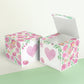 Two cubes with a pink heart on the front. One has the lid open, showing it is a box. Both made with the same template.