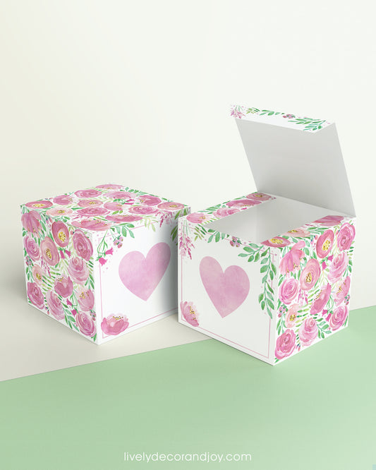 Two cubes with a pink heart on the front. One has the lid open, showing it is a box. Both made with the same template.