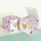 Two paper cubes with a gold heart on the front. One has the lid open, showing it is a box. Both made with the same template.