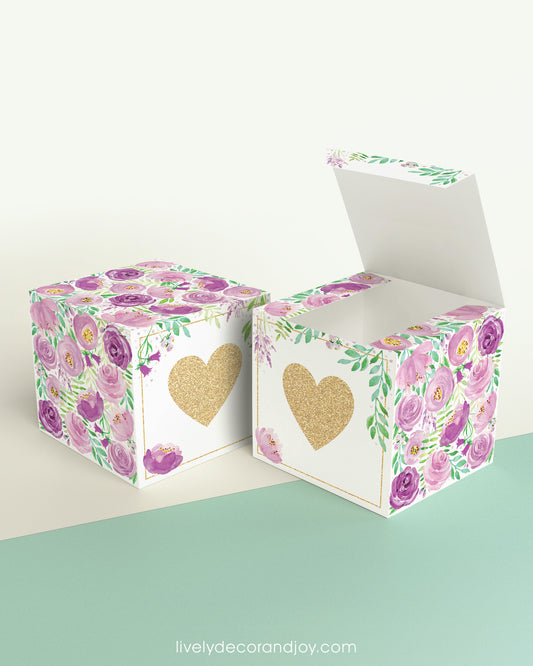 Two paper cubes with a gold heart on the front. One has the lid open, showing it is a box. Both made with the same template.