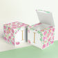 Two paper cubes with floral designs. They have a capital I on the front. One has the top open showing that it is a paper box.