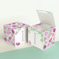 Two paper cubes with floral designs. They have a capital I on the front. One has the top open showing that it is a paper box.
