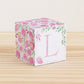 Cube with pink watercolor flowers and green leaves all around and the letter L in pink.