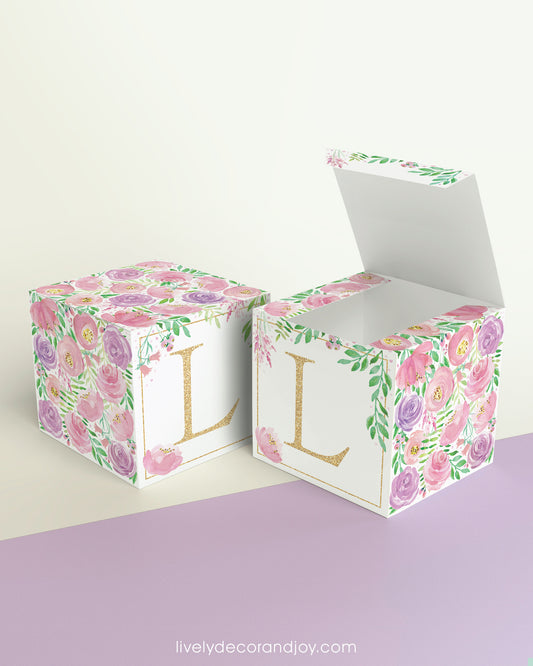 Two blocks side by side, one with the lid open to show that the printable cube template can also be used to make a box.