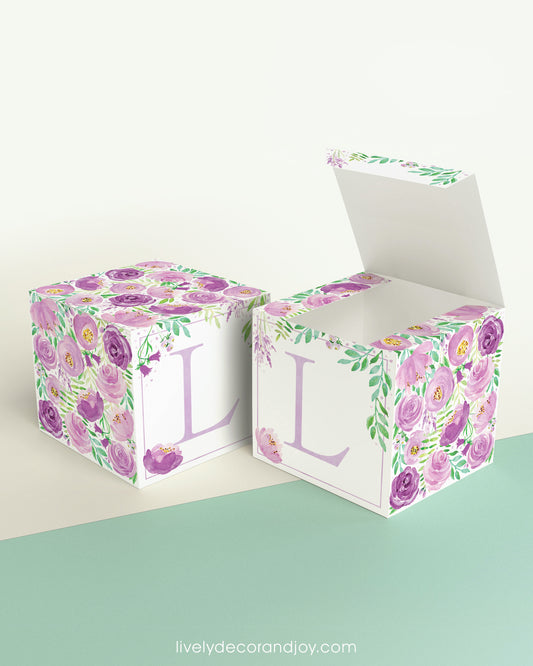 Two blocks side by side, one with the lid open to show that the printable cube template can also be used to make a box.
