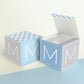 A completely closed block in the form of a cube and a box with an open lid. Both feature the same printable design.