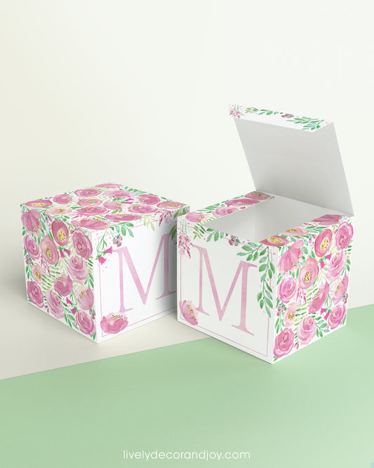 A completely closed block in the form of a cube and a box with an open lid. Both feature the same printable design.