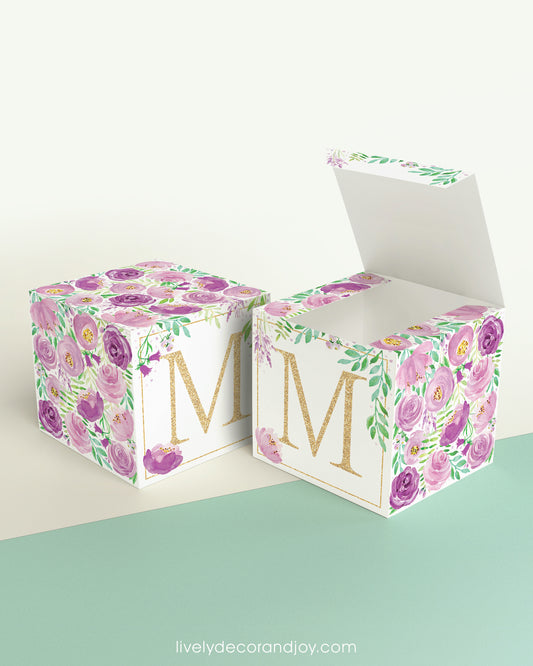 A completely closed block in the form of a cube and a box with an open lid. Both feature the same printable design.