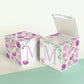 A completely closed block in the form of a cube and a box with an open lid. Both feature the same printable design.