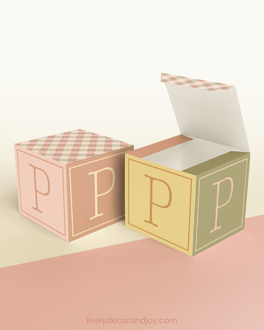 Two paper building blocks with the same vintage design. One has an open top to show that it can also be a box.