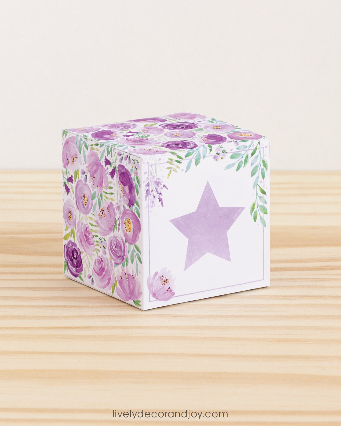Building block with floral designs and lavender star on the front. Part of a collection of printable building blocks.