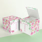 Two paper cubes with floral designs. One has the top open to show that the printable design can be used for blocks or boxes.