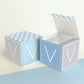 Two blocks side by side, one with the lid open to show that the printable cube template can also be used to make a box.