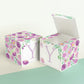 Two paper cubes with floral designs. They have a capital Y on the front. One has the top open showing that it is a paper box.