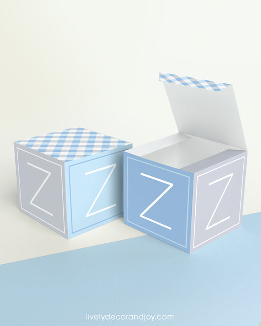Two paper cubes with designs. One has the top open to show that the printable design can be used for blocks or boxes.