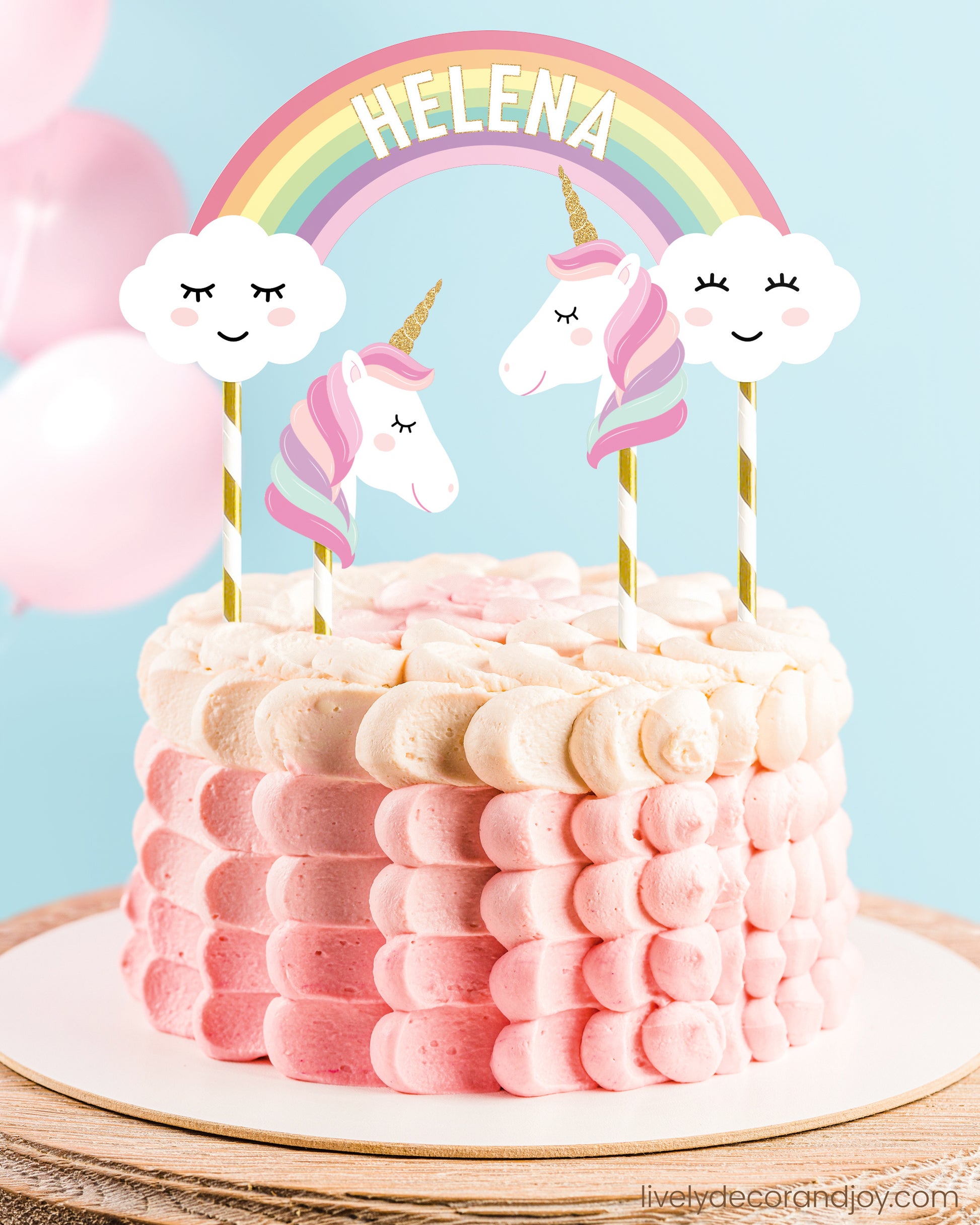 Personalized cake decoration with a name rainbow and optional unicorns in pink.