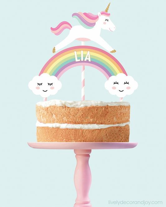 Smash cake with a printable rainbow and unicorn topper. Name personalization.