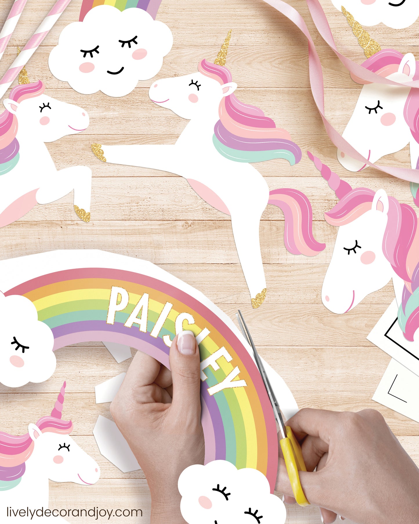 DIY rainbow cake topper with a personalized name and beautiful unicorns.