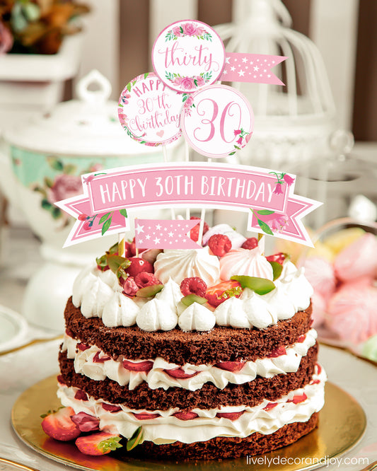 A homemade chocolate cake or strawberry cake with a unique printed cake topper made of floral watercolor designs.