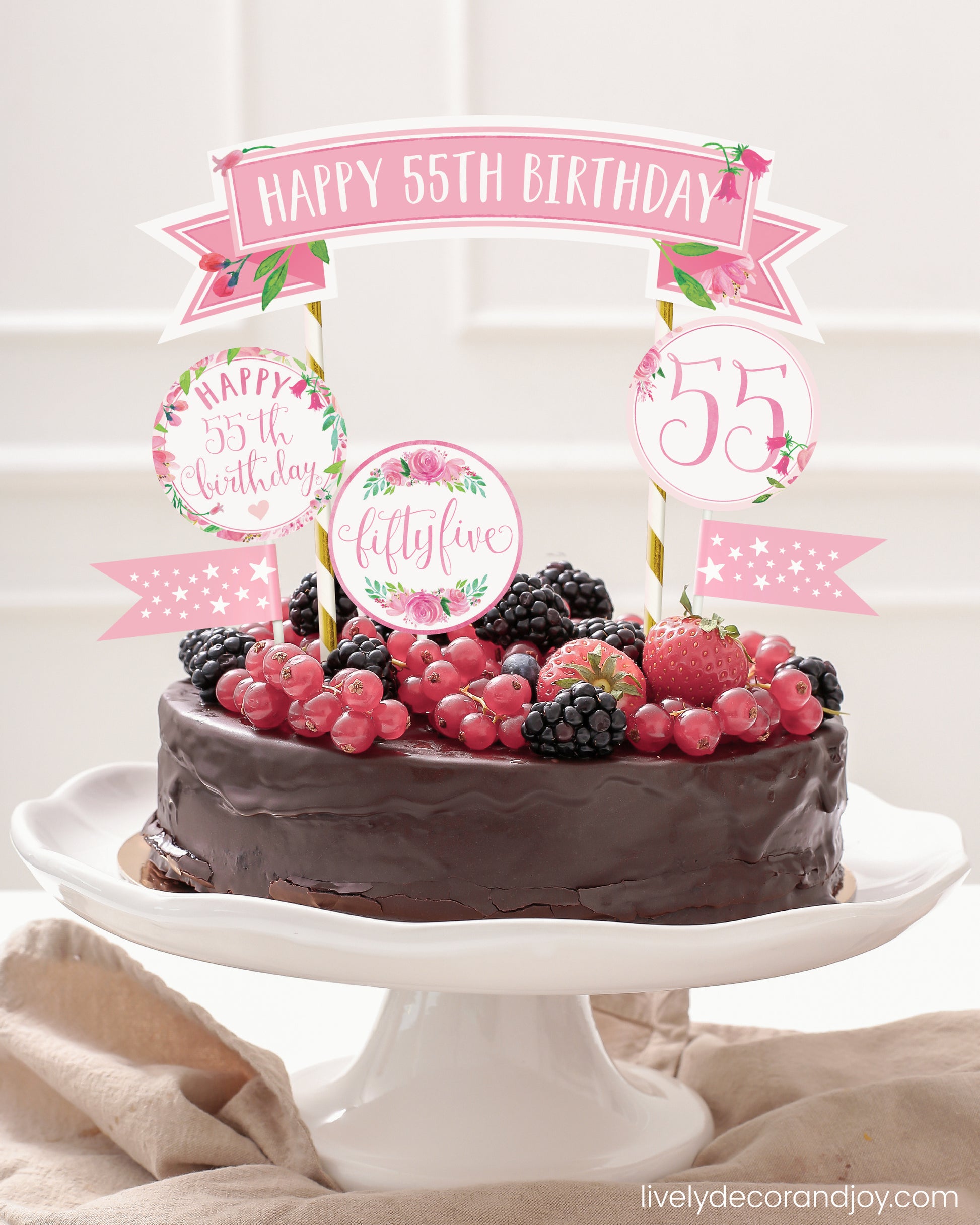 Easy chocolate birthday cake topper made of printable party ribbon and label designs.