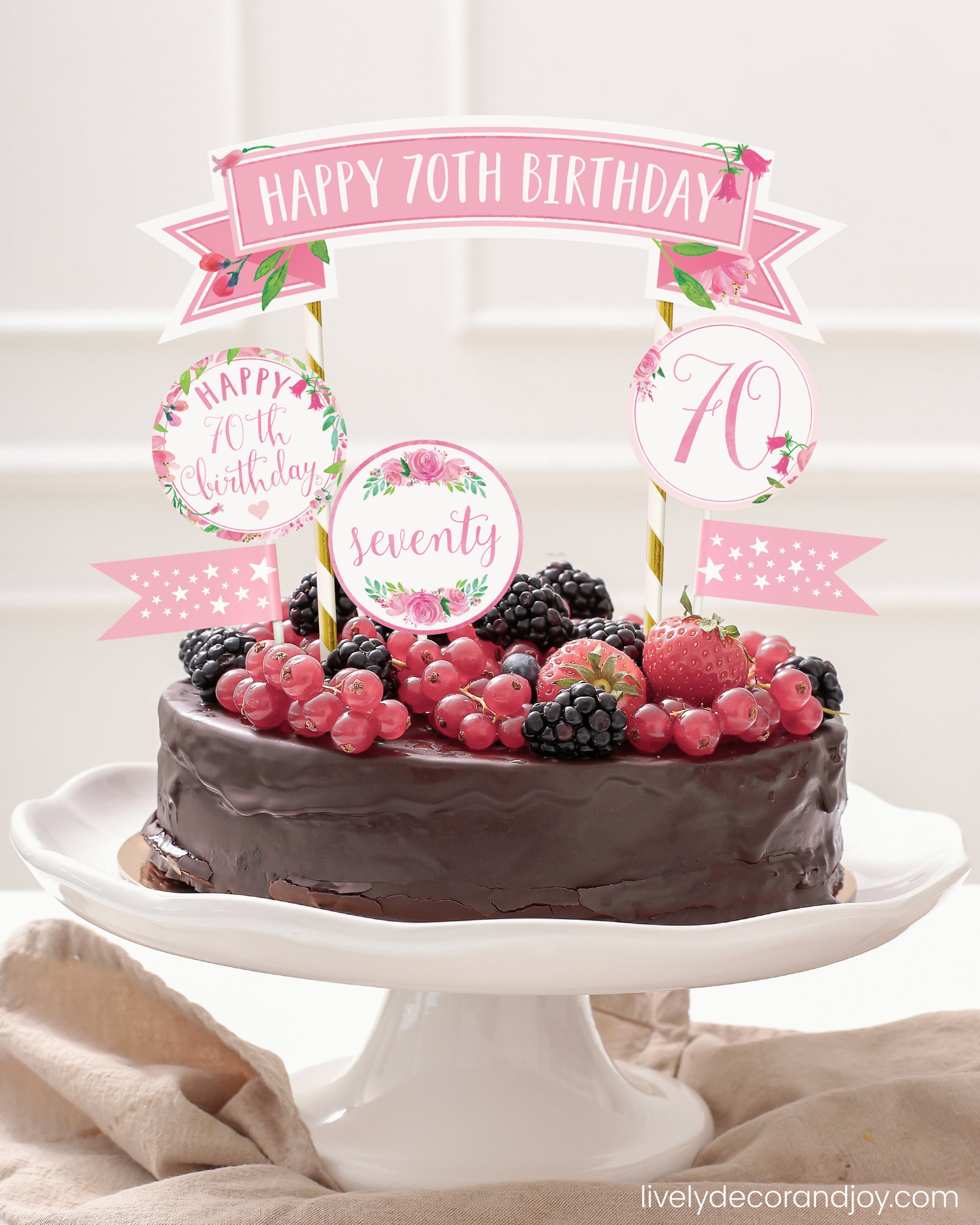 Easy chocolate birthday cake topper made of printable party ribbon and label designs.