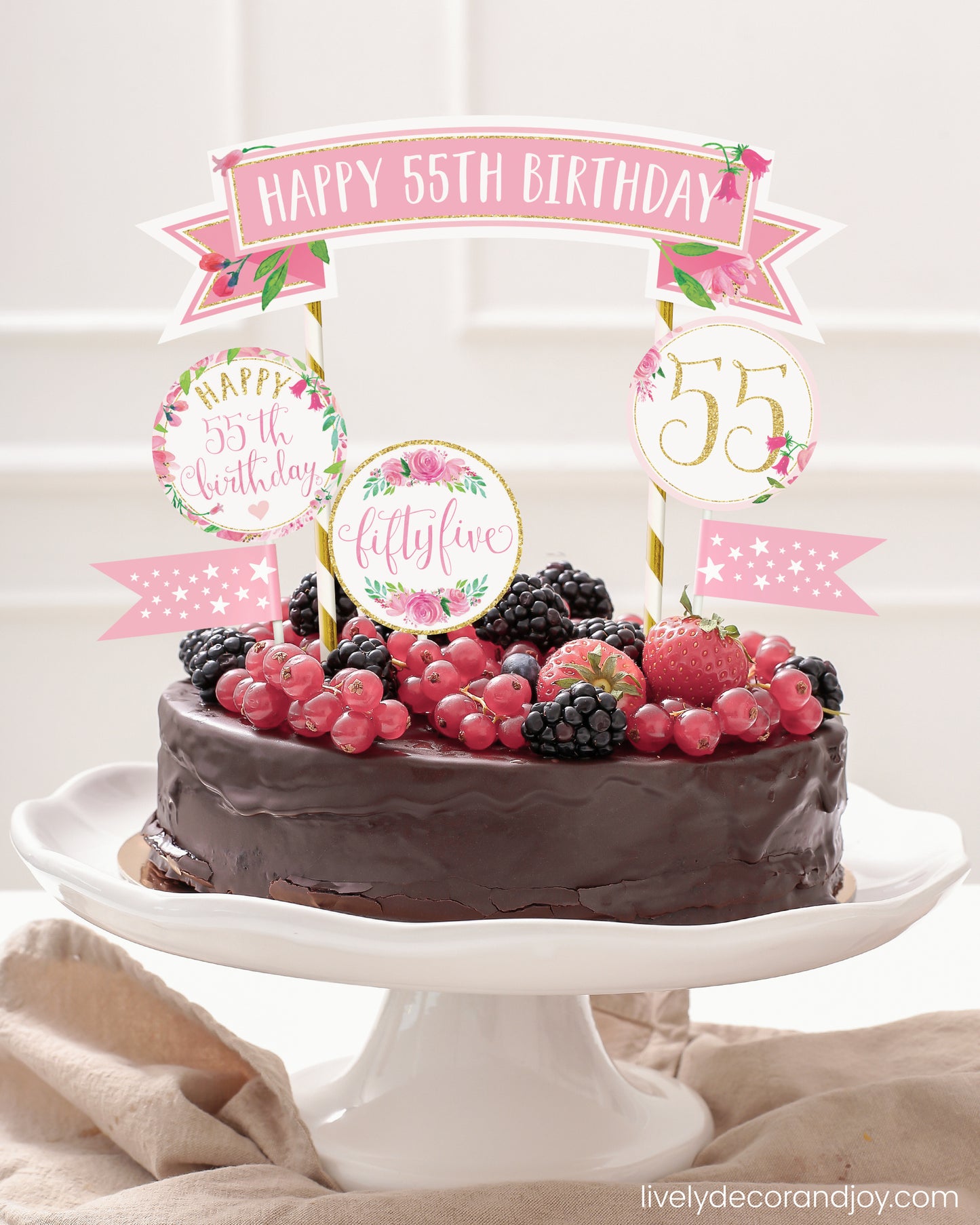 Easy chocolate birthday cake topper made of printable party ribbon and label designs.
