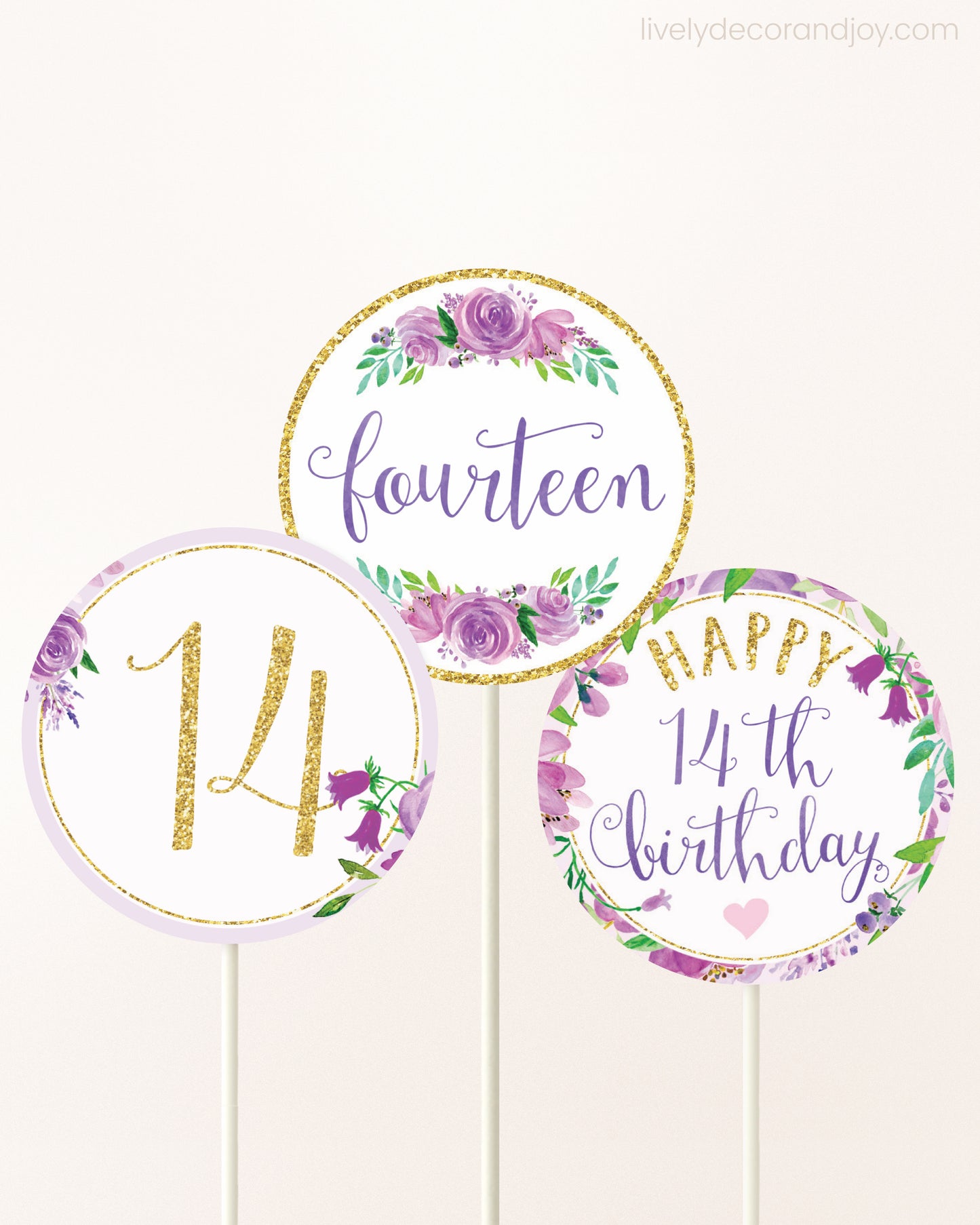 Three DIY toppers attached to lollipop sticks. They show printable cupcake topper designs with purple watercolor flowers.
