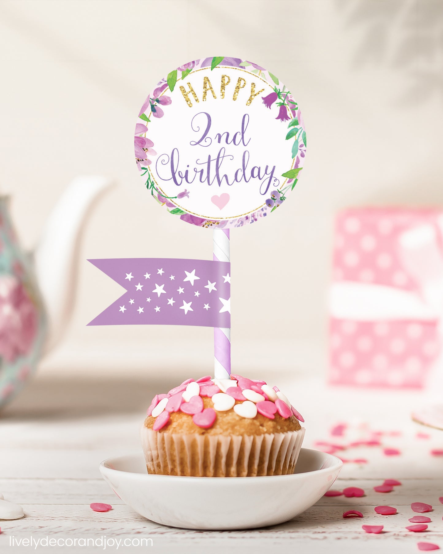 A cute 2nd birthday cupcake or muffin topper with a mini flag on a tea-themed birthday party.