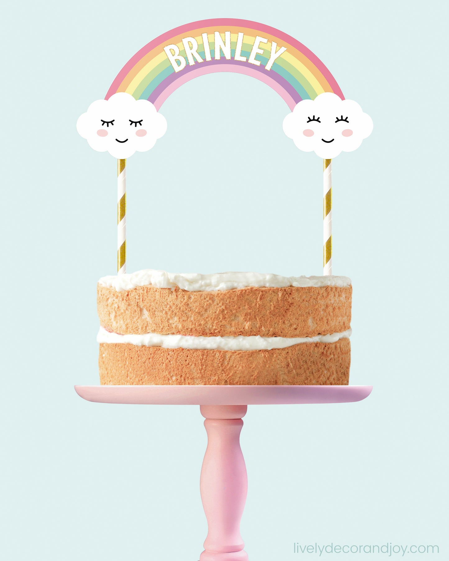 Birthday rainbow cake decoration with a name on the rainbow and unicorns.