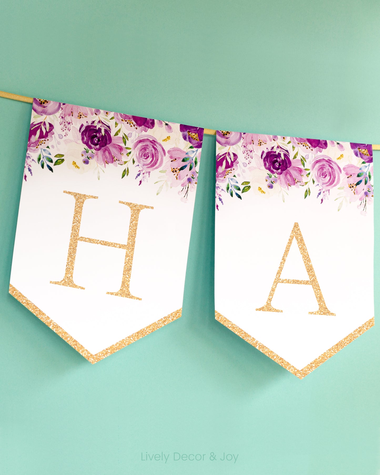 Banner flags on a wall: a Happy Birthday banner or Happy Retirement banner. They have floral designs and letters in gold.