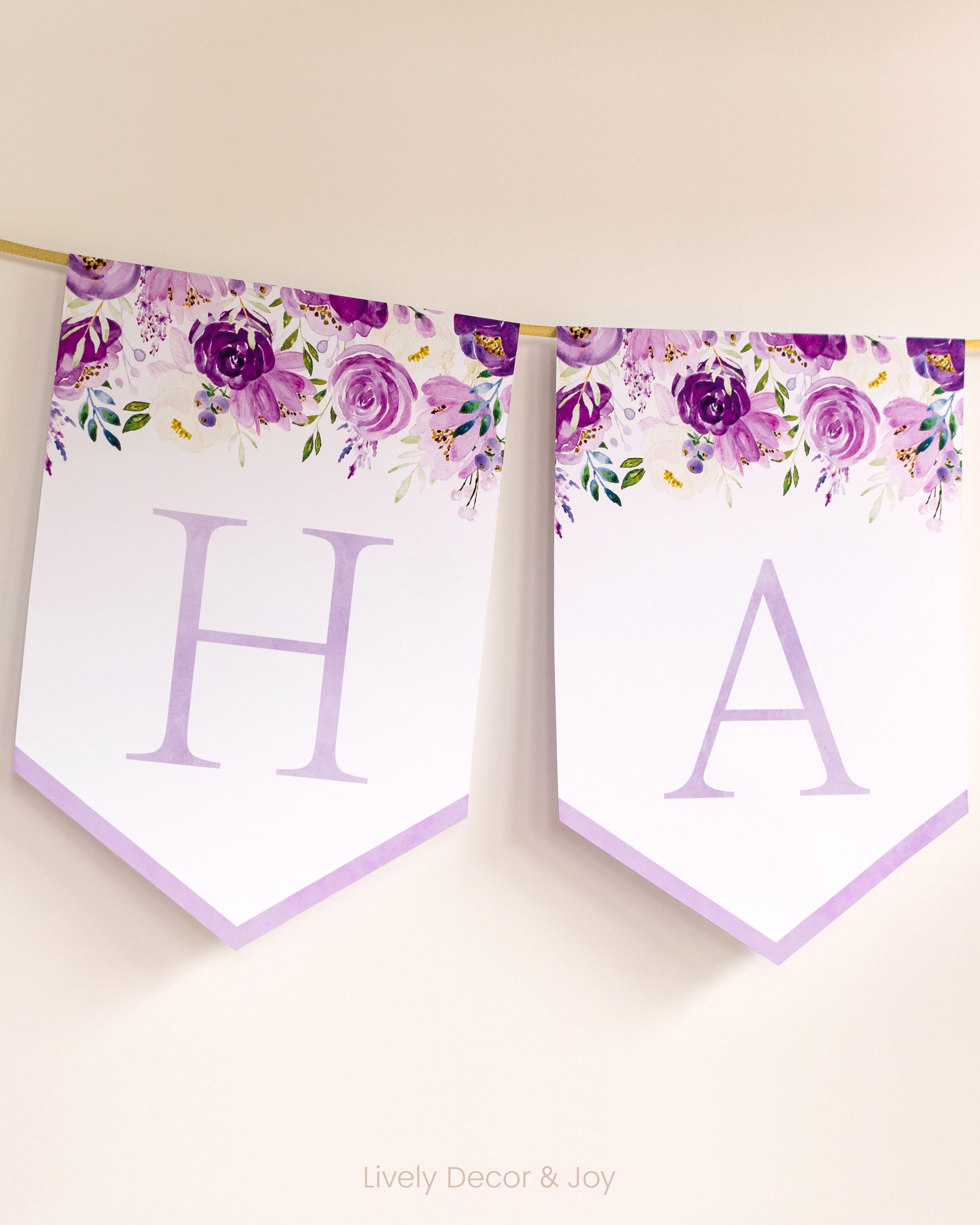 Banner flags on a wall: a Happy Birthday banner or Happy Retirement banner. They have floral watercolor designs.