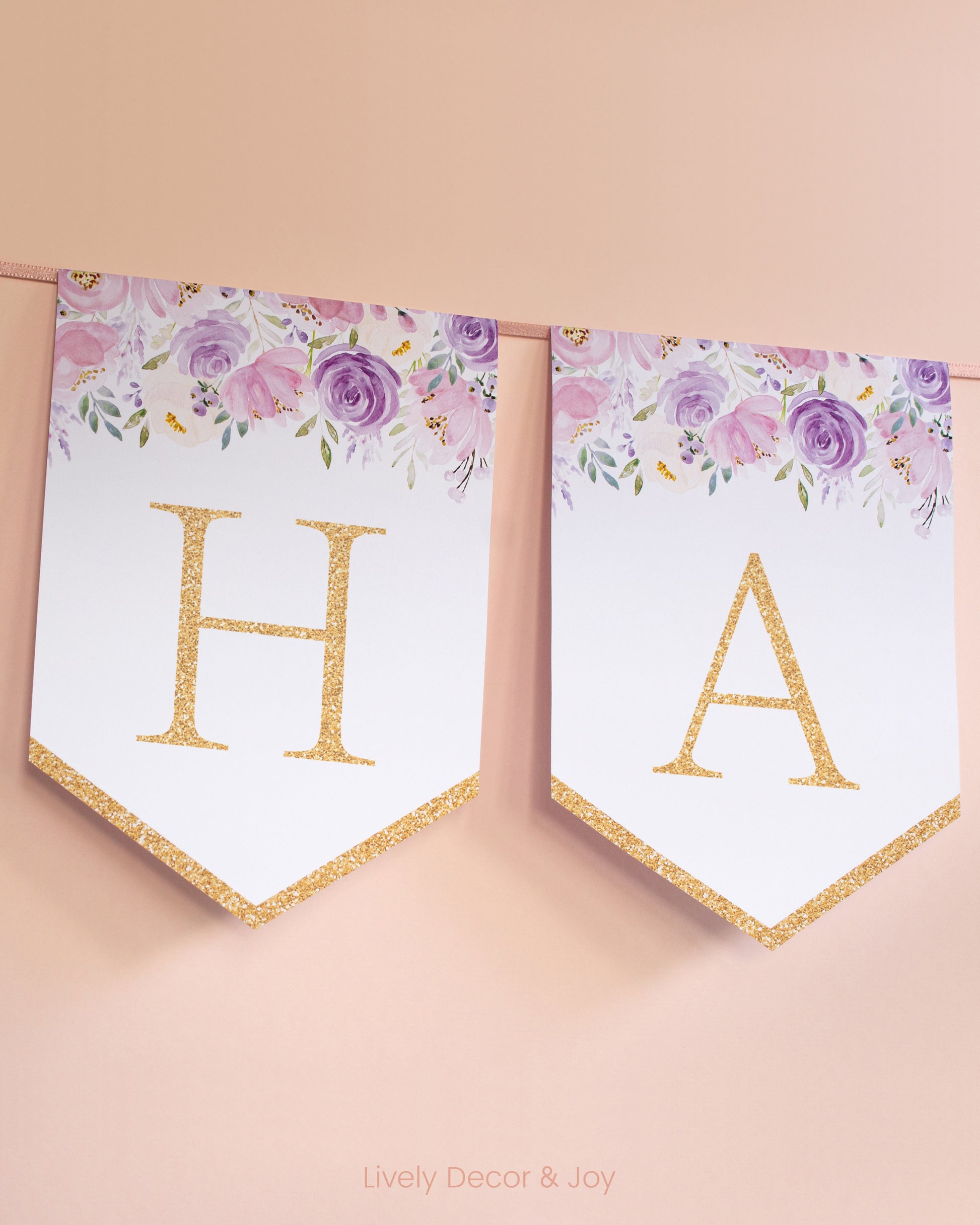 Banner flags on a wall: a Happy Birthday banner or Happy Retirement banner. They have floral designs and letters in gold.