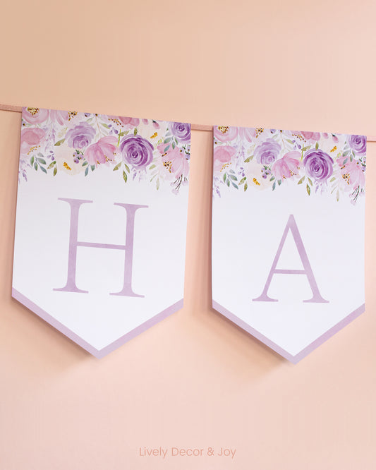 Banner flags on a wall: a Happy Birthday banner or Happy Retirement banner. They have blush and purple floral designs.